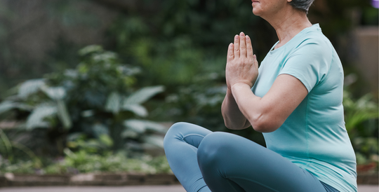 Mature women in yoga pose